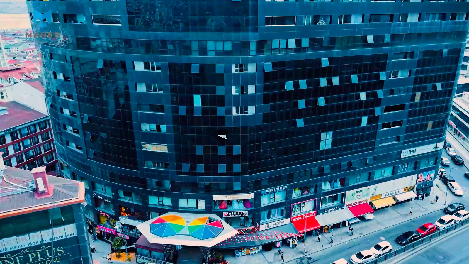 An aerial view of the building carrying the Maher Real Estate sign